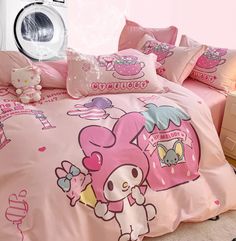 a pink bed with hello kitty on it