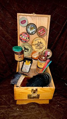 a wooden box filled with lots of different types of condiments and sauces