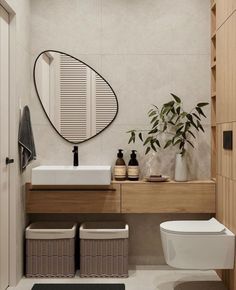 a bathroom with a toilet, sink and mirror in it's centerpieces