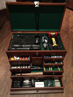 an open briefcase with many items in it