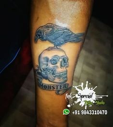 a skull with a crow on top of it and the words monster written in black ink