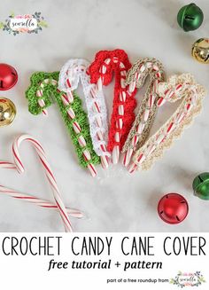 the crochet christmas candy cane cover is next to some candy canes and ornaments