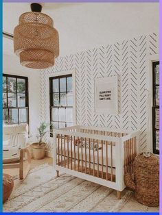 a baby's room with a crib and wicker furniture