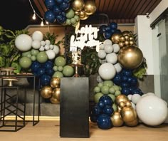 an arrangement of balloons and other decorations in a room