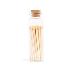 matches in a glass bottle on a white background