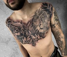 a man with tattoos on his chest has two lions and an arrow in the middle