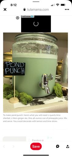 an image of a green drink in a glass container with a sign that says pound punch