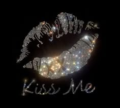 the words kiss me written in sparkling lights