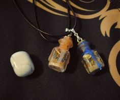 two necklaces that have been placed next to each other