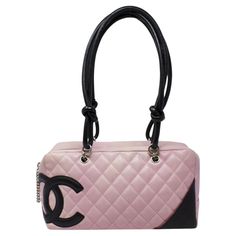 Major Y2K vibes! From 2003, in a gorgeous pink quilted leather with a large black CC logo, with silver-tone hardware and dual rolled black handles. There is a pocket on the outside and protective feet at the base. The zipper pull is a gorgeous Chanel chain that opens up to a black Jacquard Chanel logo lining with two interior pockets. The silhouette is gorgeous; the shoulder strap drops are ideal, and there is ample room for your necessities. SPECIFICS Height: 6.5" Width: 11" Depth: 4" Shoulder Channel Pink Bag, Pink Quilted Leather Bag, Chanel Bags Aesthetic, Black Pink Bag, Chanel 2000s, Chanel Things, 2000s Pink, Chanel Chain, Mode Chanel