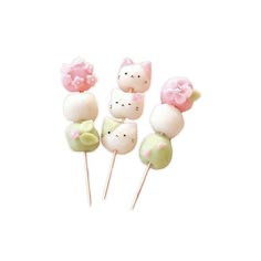 hello kitty lollipops are sitting on top of each other in pastel colors