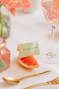 a grapefruit slice on a table with a name tag