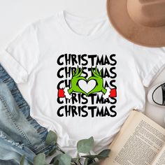 Heart Hands Shirt, Merry Christmas Tee, Grinch Christmas Shirt, Xmas Gift, Funny Christmas Shirt, Grinchmas T-Shirt, Family Christmas Tee ⭐⭐Atlascustomtees⭐⭐ ⭐ All orders totaling $35 and up ship for free to US buyers. ⭐ We use white vinyl for all colors but black vinyl for white, peach, heather athletic grey shirts. If you want black or gold vinyl please indicate on the personalization part. ⭐Sweatshirts and Hoodies: 8-ounce, 50/50 cotton/poly. T-Shirts:4.3-ounce, 100% combed ring spun cotton. Grinch Christmas Shirt, Gold Vinyl, Heart Hands, Funny Christmas Shirts, Grinch Christmas, Christmas Tees, Grey Shirt, Black Vinyl, White Vinyl