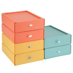 three different colored drawers stacked on top of each other