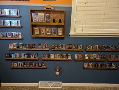 the wall is filled with books and magazines