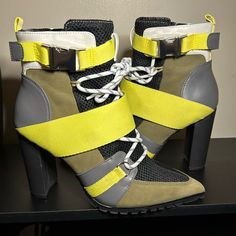 Steve Madden Illusion Multi Color Boots. Yellow/Neon Green, Black Mesh, Olive Green Suede, White And Dark Gray Accents, Silver Buckle, White And Olive Green Shoe Lace. These Are Size 8. I Am A True 7 1/2 And These Fit Me Perfectly. Gorgeous, Comfortable Boot. Yellow Lace-up Platform Boots, Yellow High Heel Shoes For Fall, Yellow High Heel Heels For Fall, Yellow Boots For Spring Party, Yellow High Heels For Fall, Yellow Platform Ankle-high Boots, High-top Yellow Boots For Spring, Sporty Yellow Boots With Round Toe, Yellow Ankle-high Spring Boots