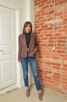 Step into the world of classic fashion with this Vintage 80s Checkered Wool Blazer, a true gem for any vintage lover. This Size Small blazer features a timeless checkered pattern that exudes sophistication and style. Made from high-quality wool, it offers both warmth and a comfortable fit. The blazer's design is a nod to the iconic 80s fashion, making it an ideal choice for those seeking to add a piece of history to their modern wardrobe. Whether you're heading to the office or a social event, t Tailored Vintage Tweed Jacket, Retro Plaid Formal Blazer, Retro Plaid Wool Blazer, Vintage Plaid Wool Blazer, Retro Wool Plaid Blazer, Retro Plaid Blazer For Formal Occasions, Retro Brown Tweed Jacket, Vintage Plaid Outerwear For Office, Retro Plaid Tweed Jacket For Fall