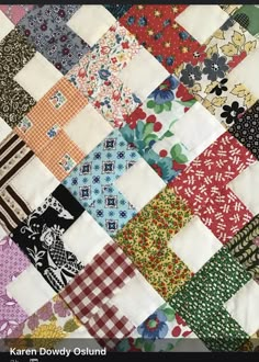 a quilt made up of many different colored squares