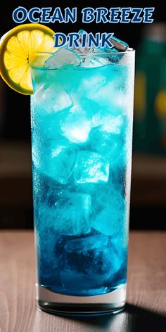 This pin showcases the Ocean Breeze Cocktail, a visually appealing and refreshing drink. With a fruity, sweet, and slightly tangy taste, this cocktail combines vodka, Blue Curacao, pineapple juice, and grapefruit juice. Garnish with a lemon wheel and cherry for the perfect tropical vibe