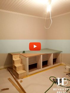 an unfinished room with stairs and shelves in it