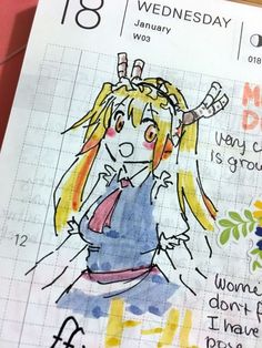 a drawing of a girl with blonde hair and blue overalls is on a notebook