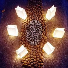 some paper bags are on the ground with rocks and pebbles around them, as if they were floating or floating in water