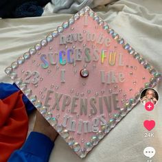 a pink graduation cap that says i have to be successful