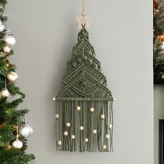 a christmas tree hanging from the side of a wall