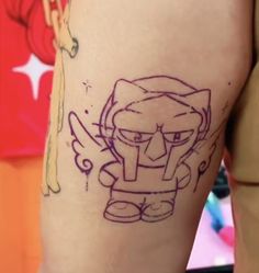 a person with a tattoo on their leg and the image of an angry bird behind them