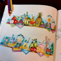 an open book with drawings of fruits and vegetables