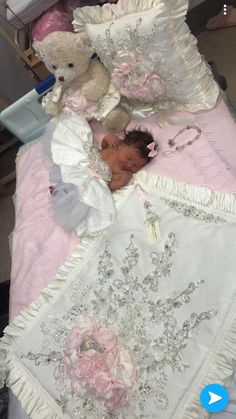 a baby is laying in a crib with teddy bears