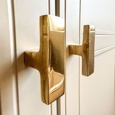 a close up of a door handle on a white door