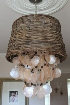 a chandelier hanging from the ceiling in a living room