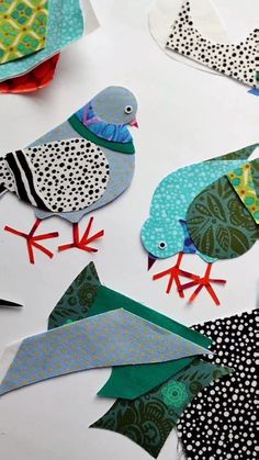 paper birds are cut out and placed on the table