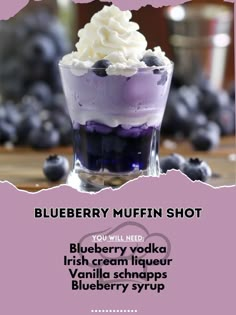 the blueberry muffin shot is served in a glass with whipped cream on top