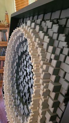 a clock made out of books in a room