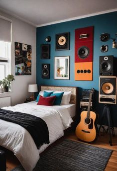 a bedroom with blue walls and guitars on the wall