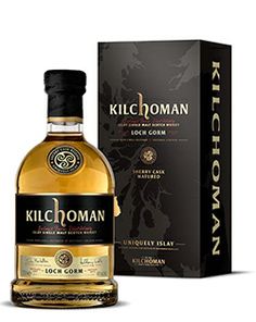 a bottle of kilchomann whisky next to a box