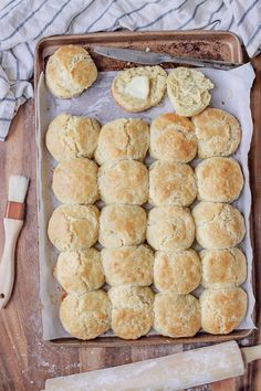 homemade biscuits and butter on a baking sheet