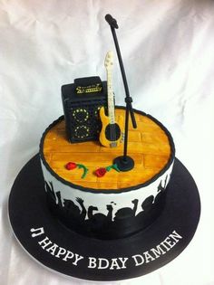 a birthday cake with an acoustic theme on it