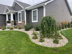 a house with landscaping in the front yard