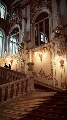 an ornate staircase in the middle of a building