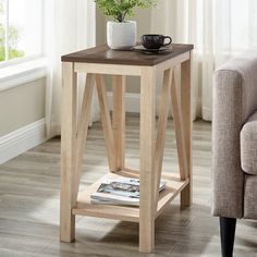 a small wooden table with a magazine on it