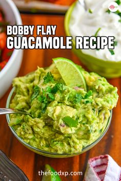 a bowl full of guacamole with a spoon in it and the title overlay reads bobby flay guacamole recipe