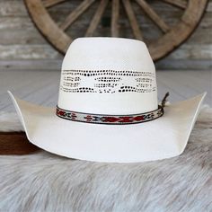 Introducing the Resistol Young Gun cowboy hat, designed for the modern-day trailblazer. Crafted from durable Bangora straw with a commanding 5 1/4" rounded brick crown and a versatile 4 1/4" brim, it exudes rugged charm and authenticity. Adorned with a Native American-inspired pattern hatband featuring a feather accent, this hat is the perfect blend of tradition and contemporary style for every cowboy's journey. 4 1/4" Brim 5 1/4" Crown Color: Natural Bangora straw Cow Boy Hats, Straw Cowboy Hat, Custom Tumbler Cups, Custom Tumbler, Cowgirl Hats, Hat Band, Cowboy Hat, Custom Tumblers, Tumbler Cups