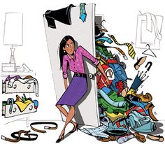 a woman is standing in front of a pile of clothes and other items that are piled on top of each other