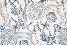 a blue and white wallpaper with sea animals, plants and seashells on it