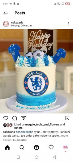 the cake is decorated with blue and white icing on it's frosting