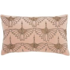 a pink and gold embroidered pillow on a white background