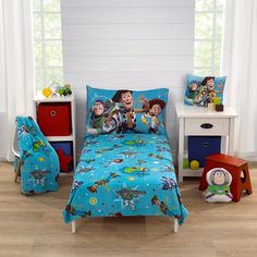 a bedroom with toy story bedding and toys